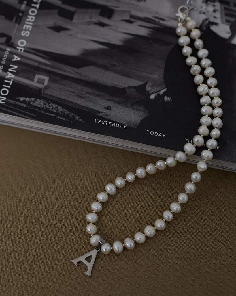 Pearls with silver letter