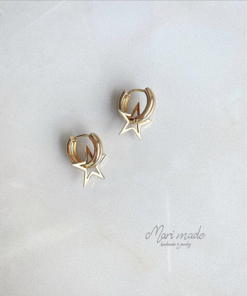 Gold colour classic earrings with a star