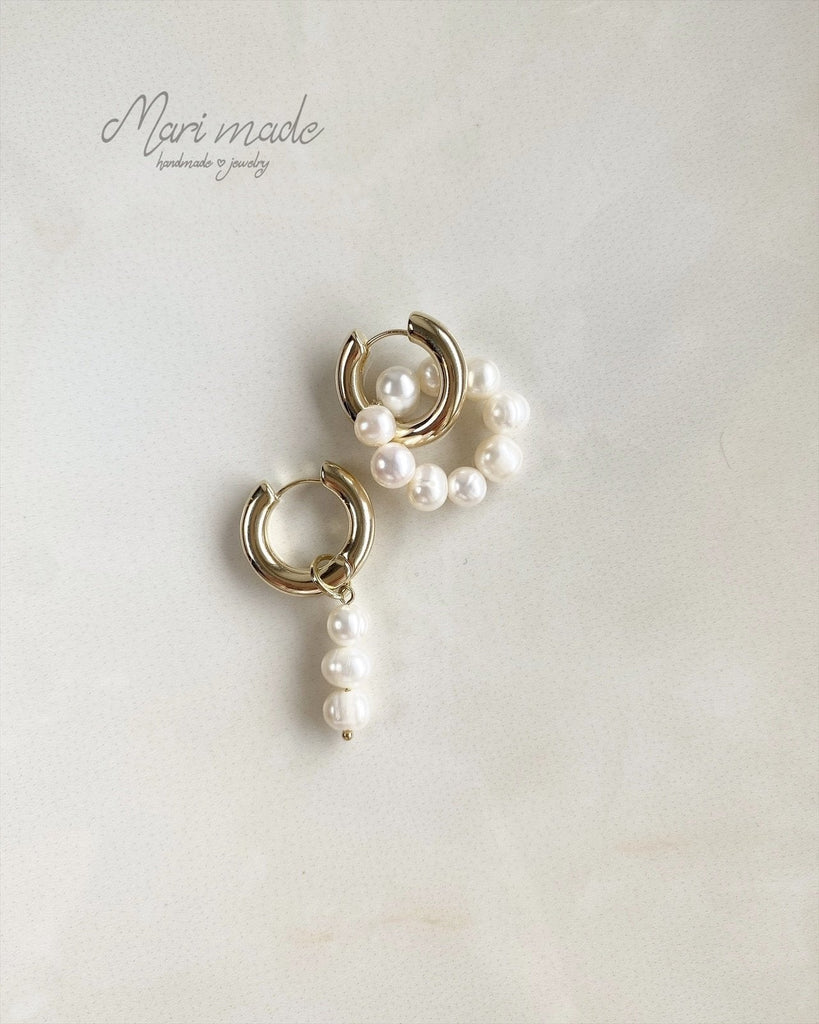 Gold earrings with white pearls