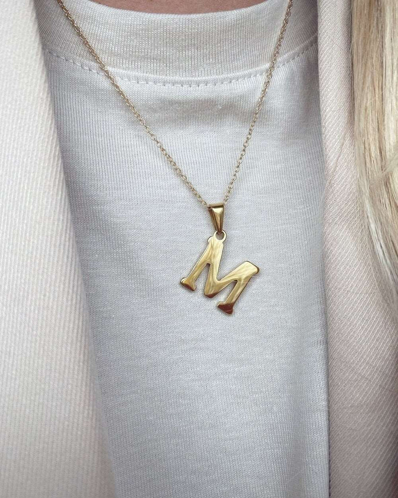 Minimalist gold necklace with letter