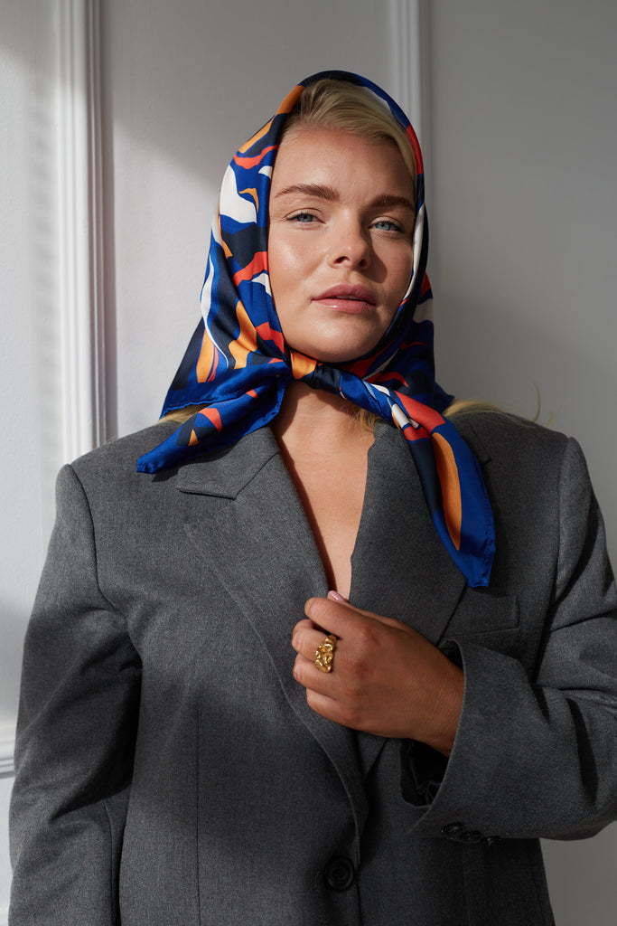 Dark blue scarf with subtropical motives