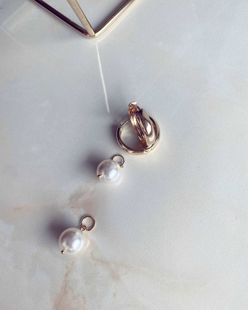 Classic gold earrings with a pearl