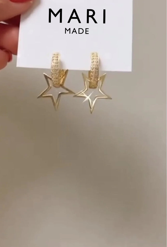 Sparkling earrings with star pendant