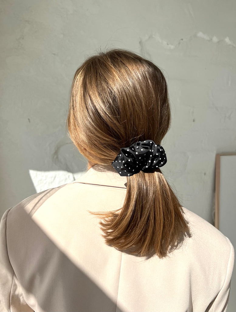 Black hair clip with white dots