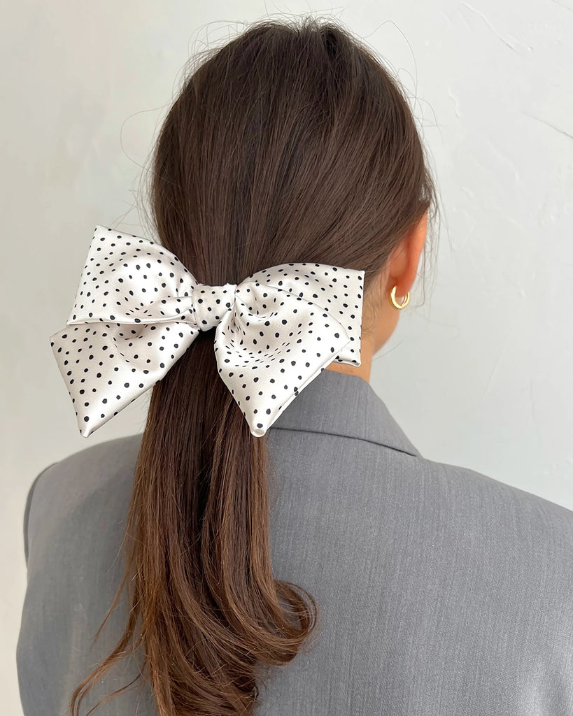 White bow hair clip with dots