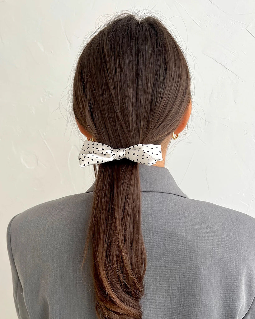 White mini bow hair clip with dots