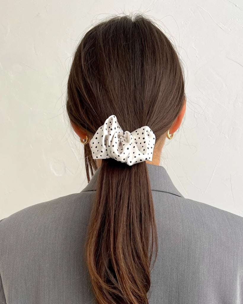 White scrunchie hair clip with dots