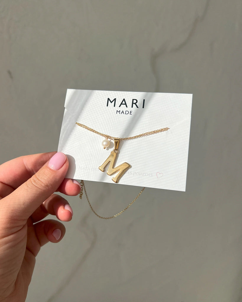 Gold necklace with letter