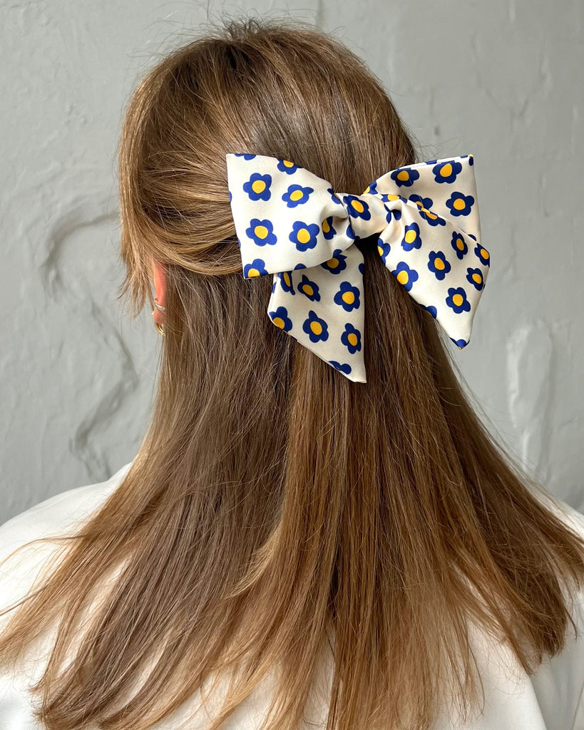 White bow barrette with flowers