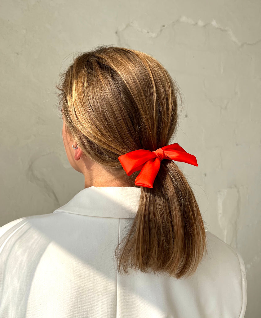 Bright orange mini bow hair clip