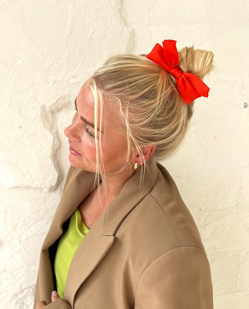 Bright orange mini bow barrette