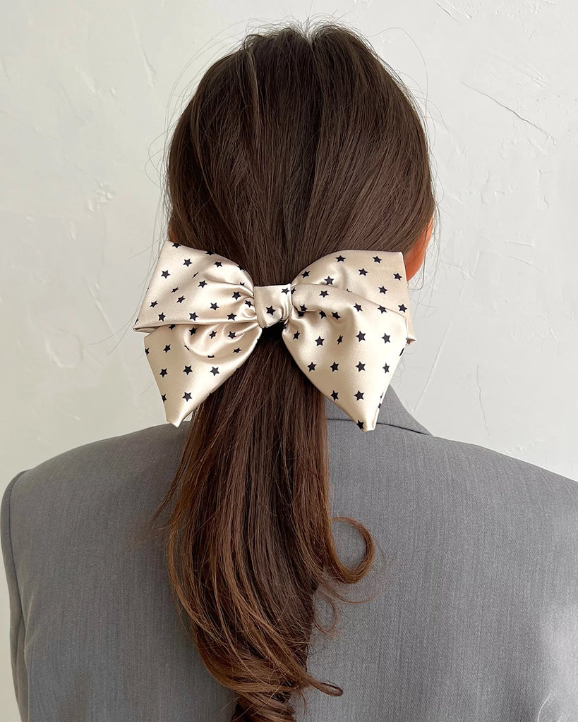 Nude bow hair clip with stars