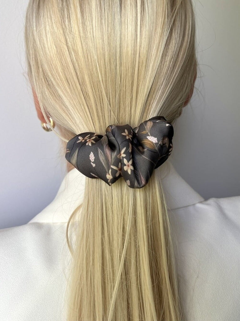 Dark brown hair clip with light flowers