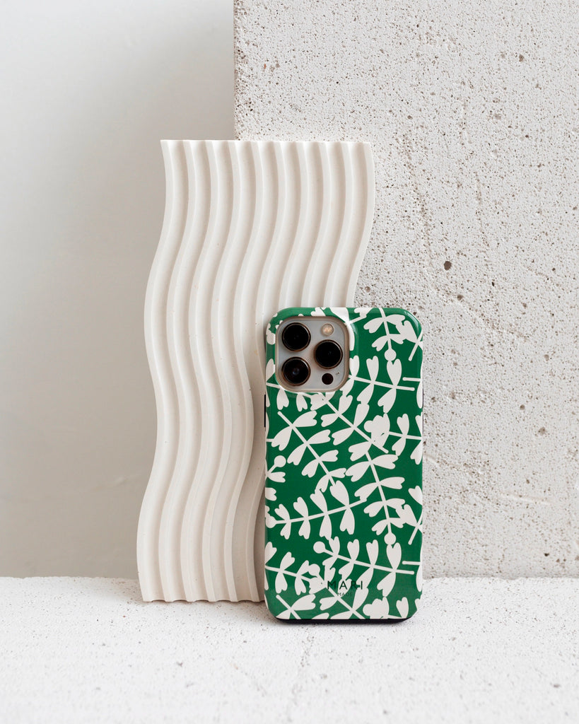 Bright green phone case with white leaves