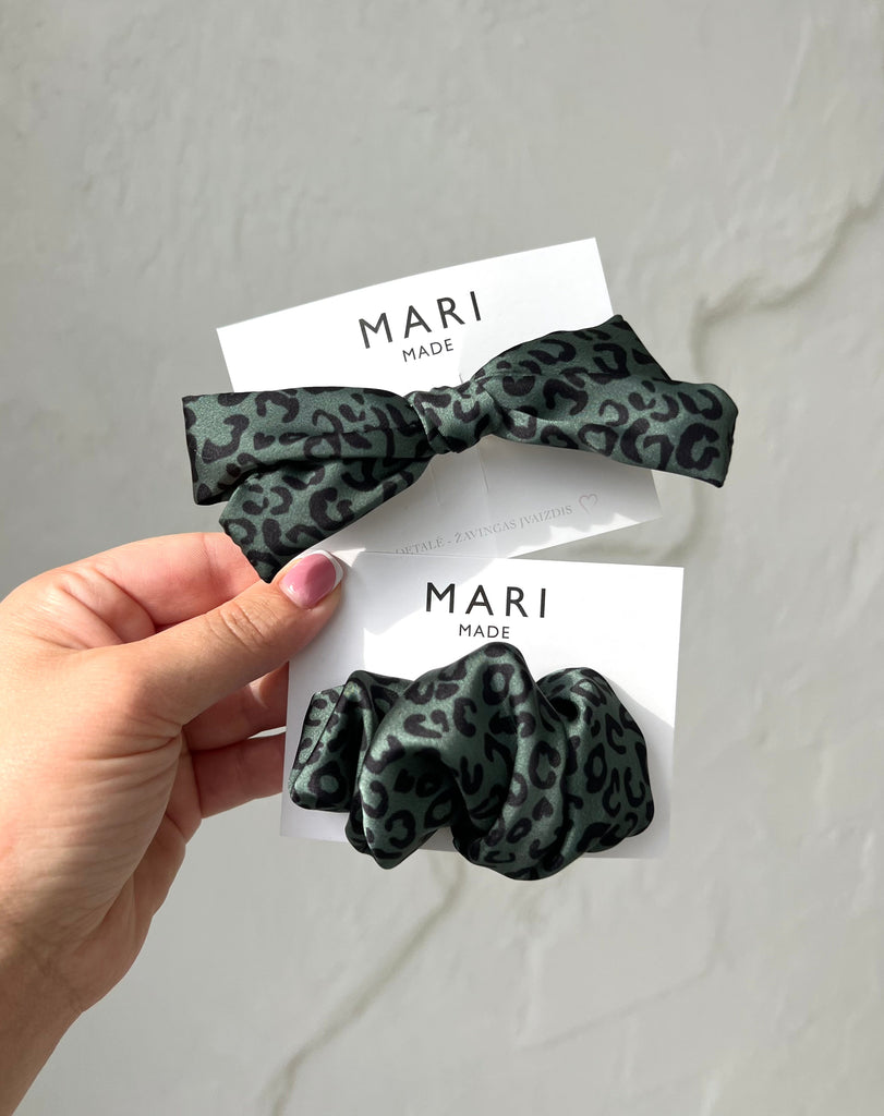 Green scrunchie hair clip with black motives