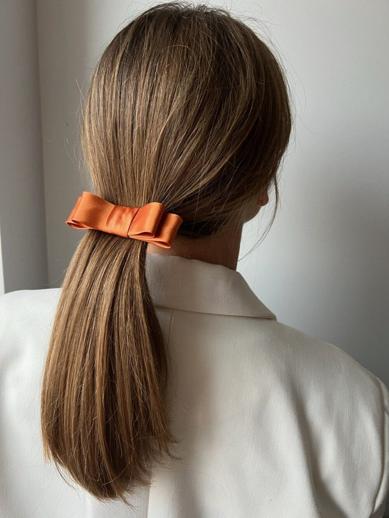 Bright orange ribbon hair clip