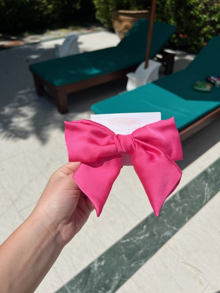 Bright pink bow hair clip